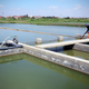 The concrete channels in the climate-smart fish farming system developed by WorldFish can each hold up to 10,000 tilapia.